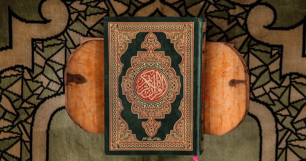 Stacked books resting on a textured cloth